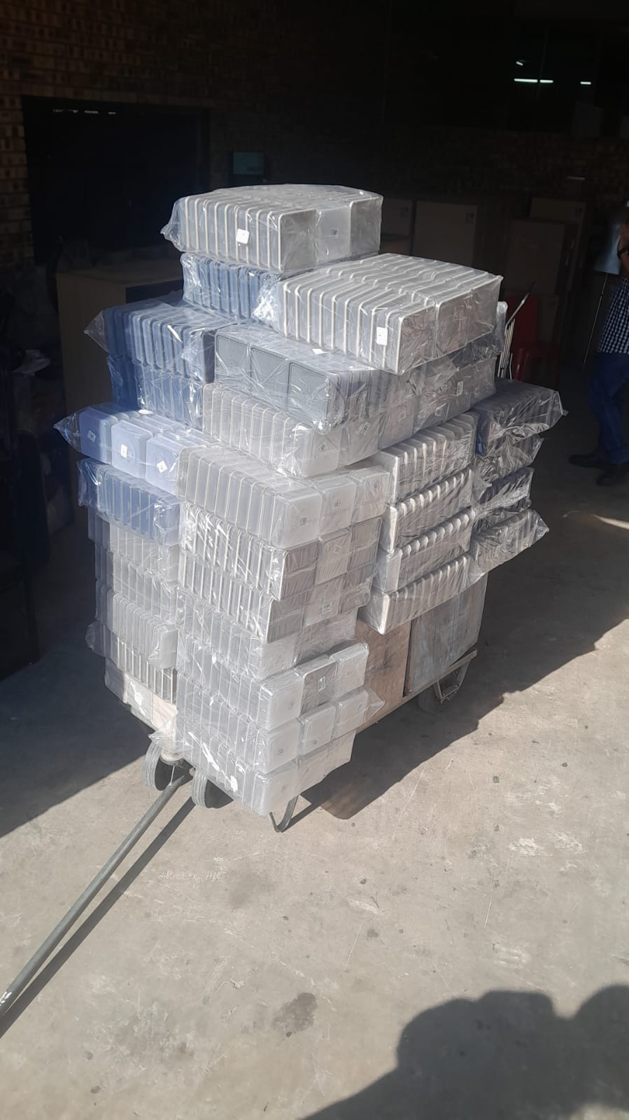 Wrapped parcel bundles stacked on a trolley